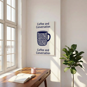 Flat graphic canvas print with a symmetrical design of a coffee mug and the words 'Coffee and Conversation' in high contrast.