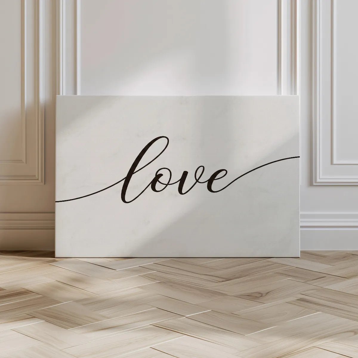 Clean and modern canvas art with monochrome styling and the word 'love' in flowing black script.