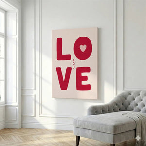 Flat graphic canvas print showing the word LOVE in red with YOU vertically aligned between L and V on a light pink background