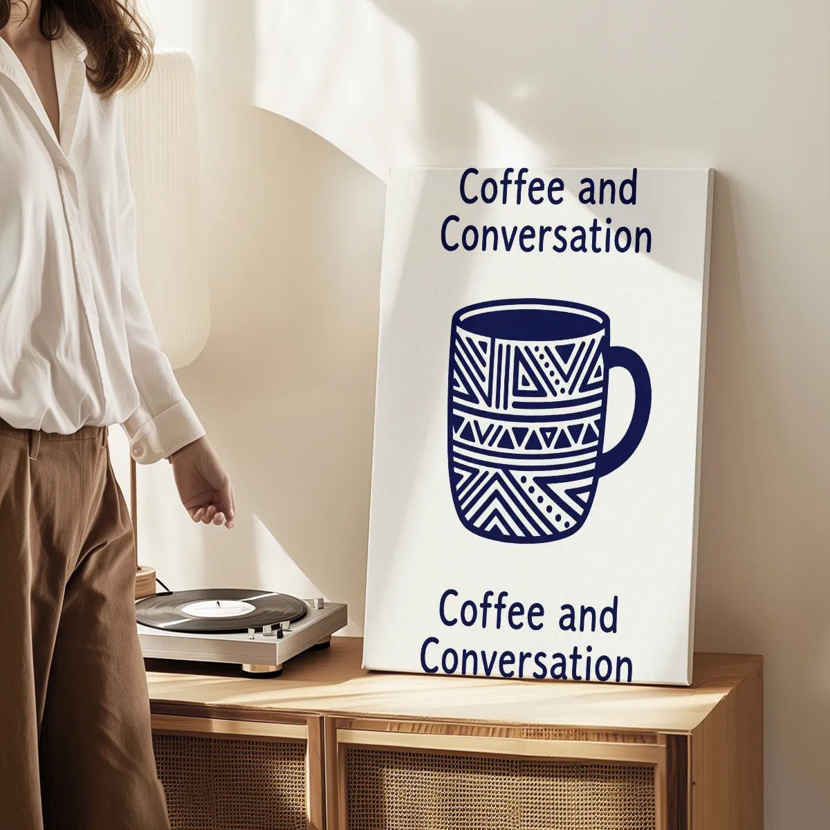 Canvas wall art print showing a geometric coffee mug and symmetrical text layout in a warm, inviting composition.