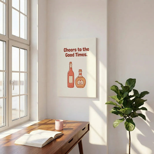 Playful canvas wall art with bold text reading 'Cheers to the Good Times' above two stylized liquor bottles on a beige backdrop.