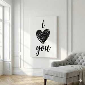 Simple canvas wall art with a centered black heart and handwritten-style 'i' and 'you' text in a clean monochrome design