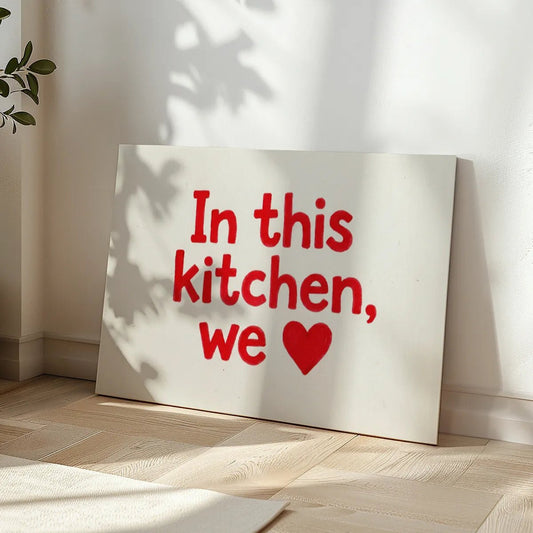 Minimalist canvas wall art with centered red typography and heart icon on a white canvas surface