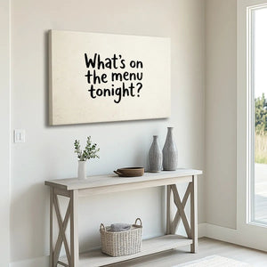 Canvas wall art with bold hand-drawn typography spelling 'What's on the menu tonight?' against a flat beige backdrop