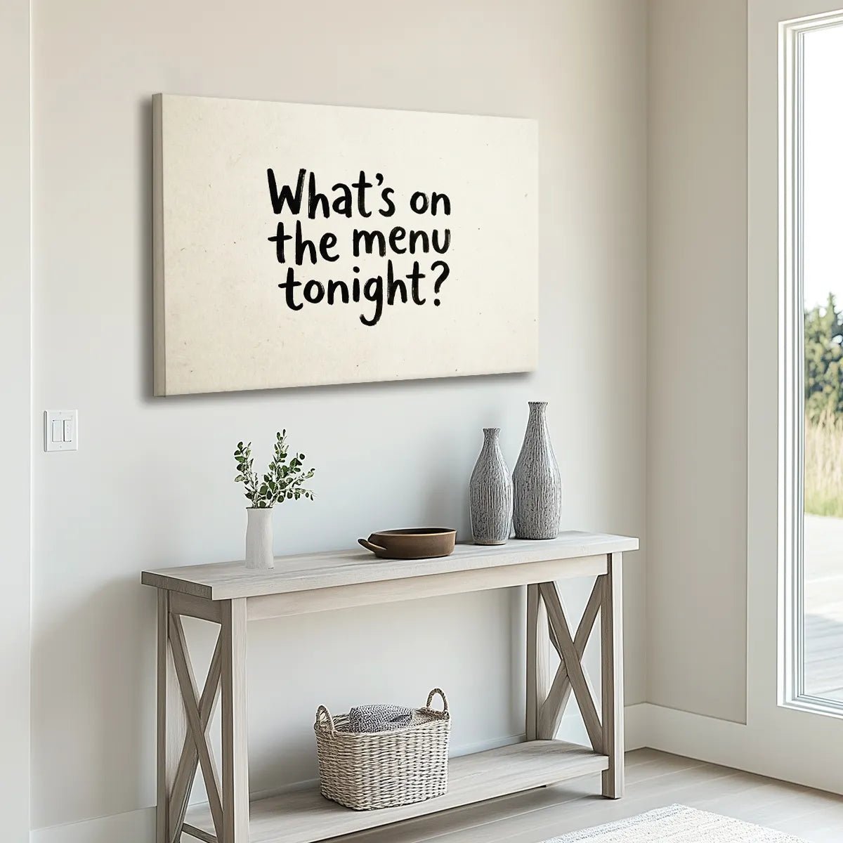 Canvas wall art with bold hand-drawn typography spelling 'What's on the menu tonight?' against a flat beige backdrop