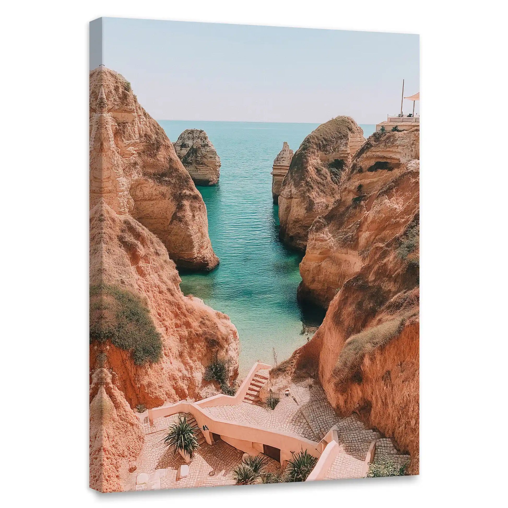 Cliffside coastal canvas wall art for bedroom featuring rugged red rocks and turquoise sea