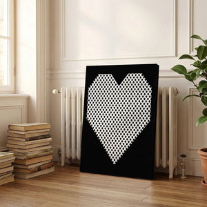 Decorative canvas print with a bold heart shape filled with black dots, ideal for contemporary or urban interiors