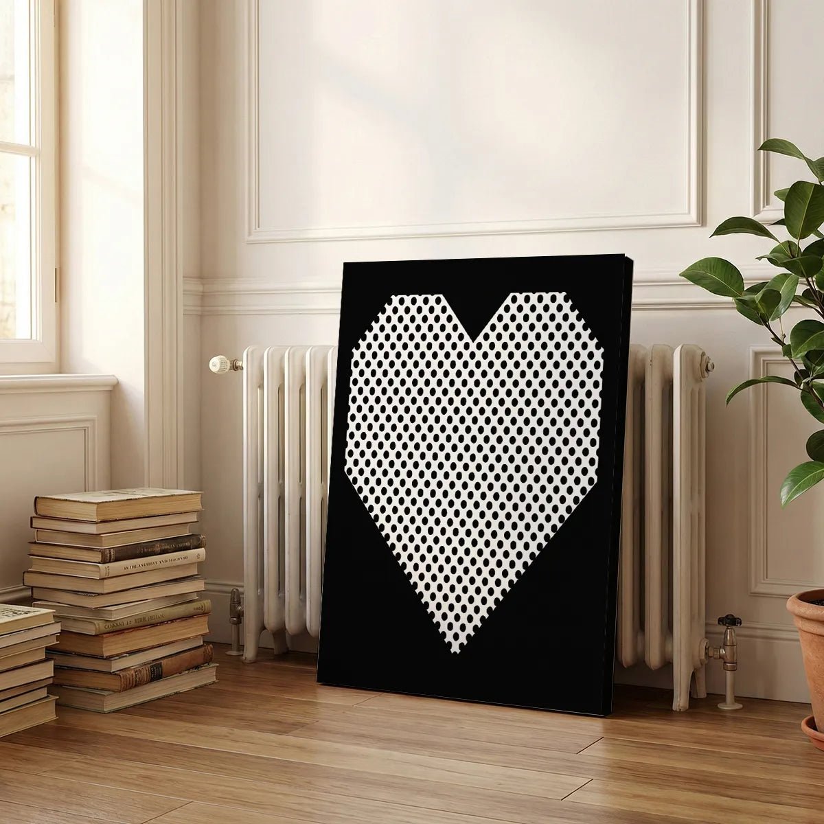 Decorative canvas print with a bold heart shape filled with black dots, ideal for contemporary or urban interiors