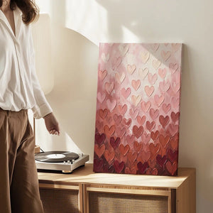 Canvas wall art print with a romantic gradient of layered hearts in textured acrylic, ideal for feminine interior settings
