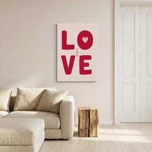 Clean and modern canvas wall decor with centered red lettering spelling LOVE and a heart shape replacing the O