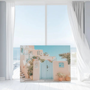 Large coastal canvas print featuring seaside village architecture in warm peach tones