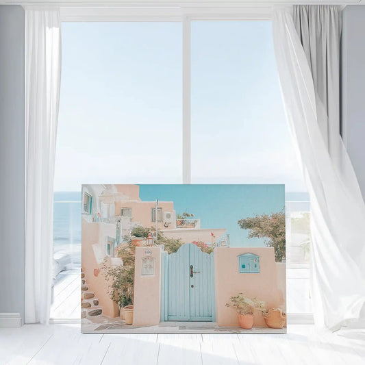 Large coastal canvas print featuring seaside village architecture in warm peach tones