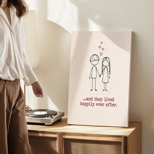 Gallery wrapped canvas showing a whimsical stick figure boy and girl under red hearts with the phrase '...and they lived happily ever after.'