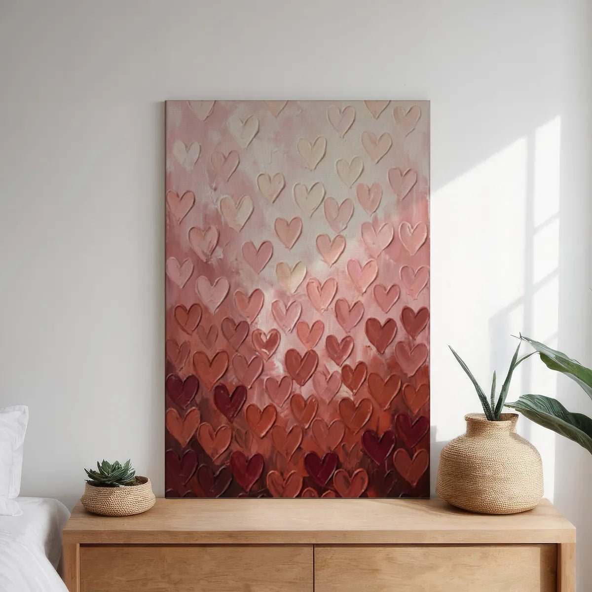 Decorative canvas print with a centered composition of repeating hearts in soft pinks and creams, evoking warmth and love
