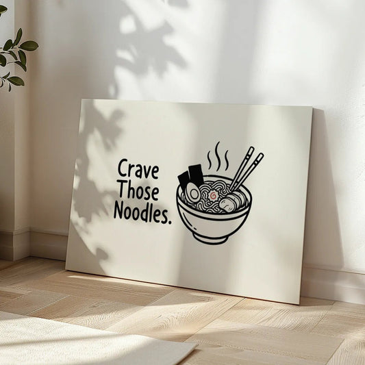 Minimalist canvas wall art with clean typography reading 'Crave Those Noodles' and a flat illustration of ramen on the right.