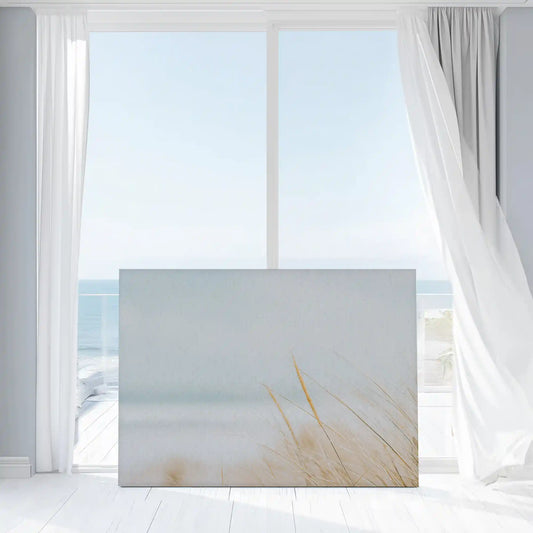 Neutral shoreline wall decor bringing calm and airy seaside mood to interiors