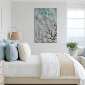 Dynamic shoreline foam canvas art complementing airy coastal-inspired home decor