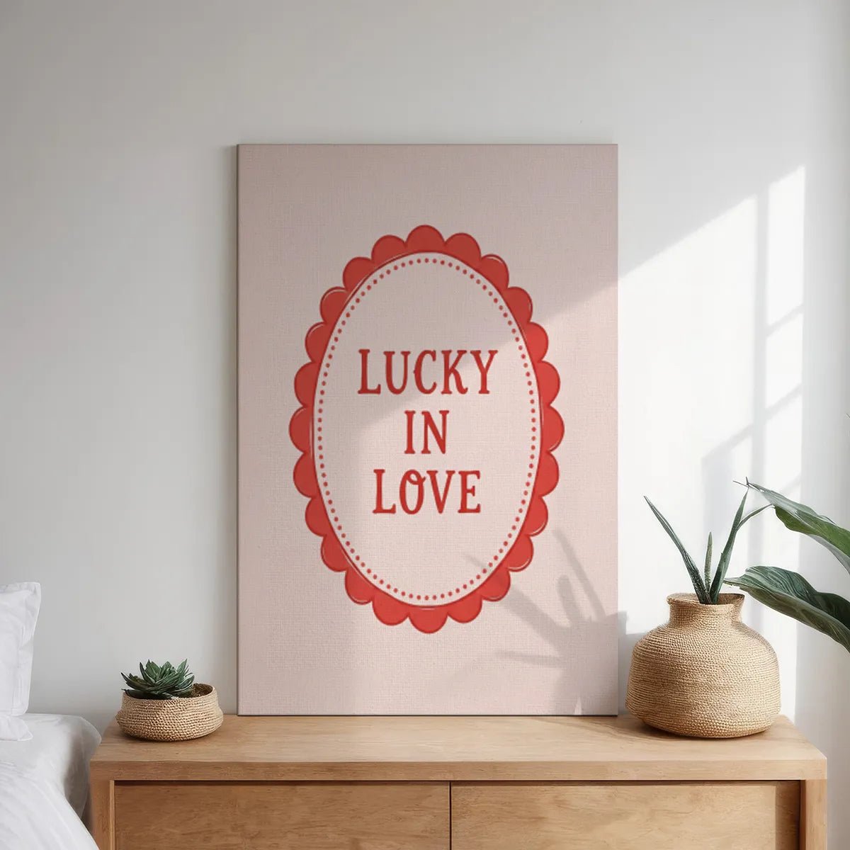 Decorative canvas print with clean lines and a vintage scalloped border surrounding bold red text