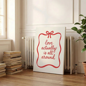 Gallery wrapped canvas showing cheerful red cursive text within a loose ribbon rectangle on a white field