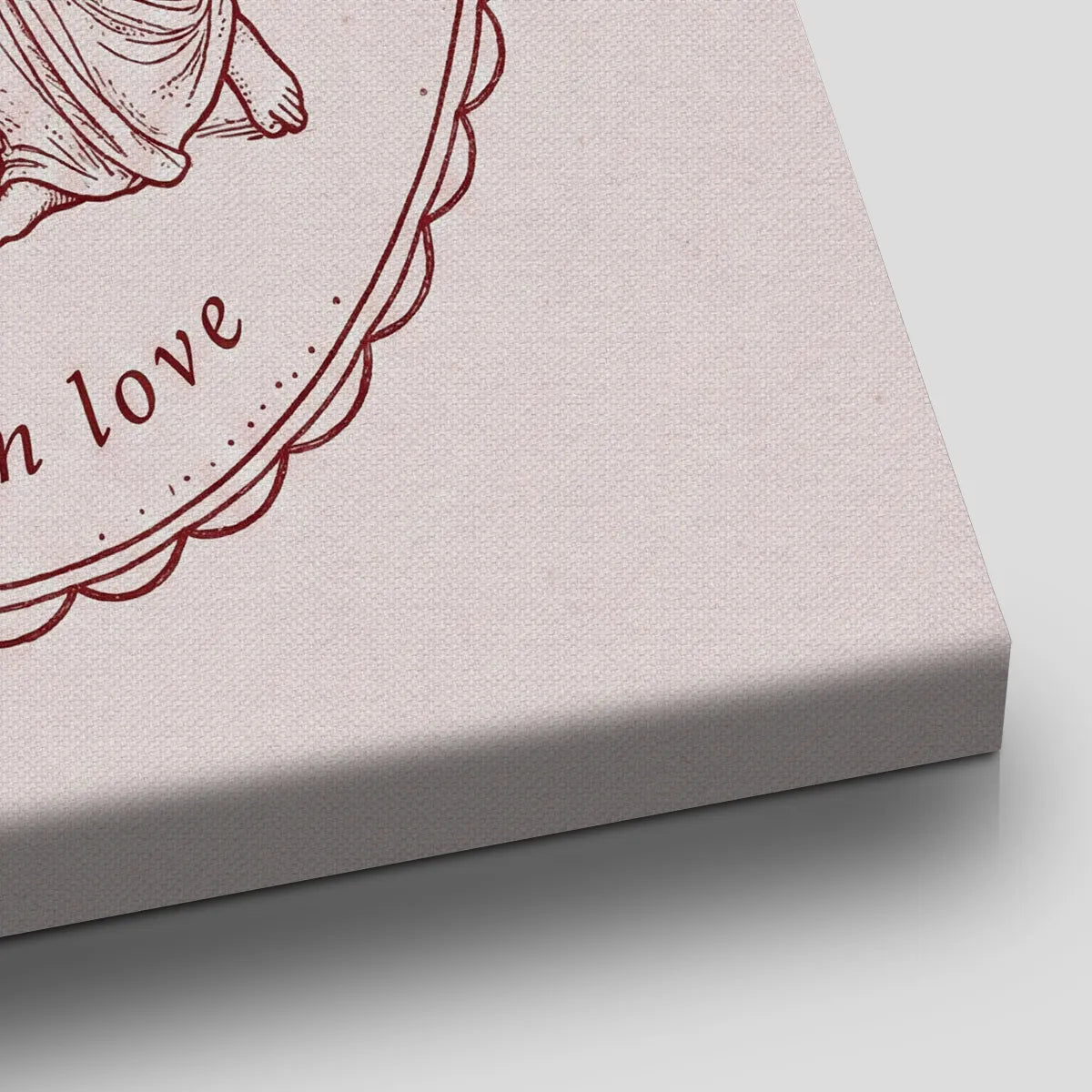 Romantic canvas wall art showing a winged figure embracing a draped partner within a detailed oval border and muted burgundy tones.