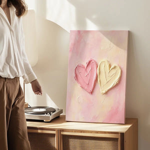 Decorative canvas print with overlapping cream and pink hearts, evoking a cheerful and loving mood through soft colors.