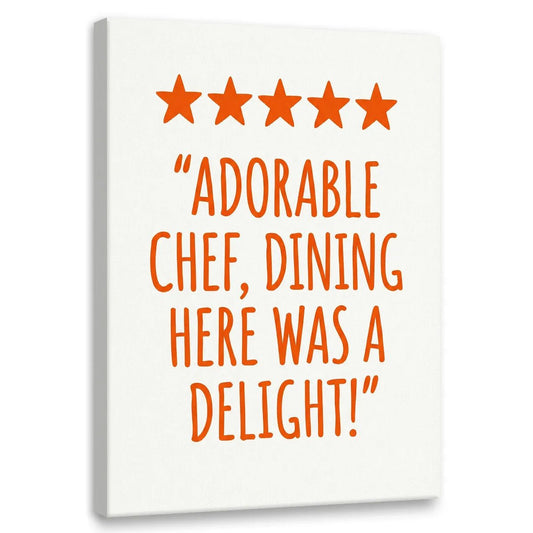 Modern canvas wall art featuring five orange stars above bold orange text reading 'ADORABLE CHEF, DINING HERE WAS A DELIGHT!' on white background