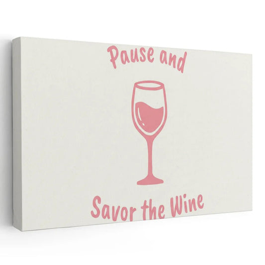 Canvas wall art featuring a pink wine glass with the phrase 'Pause and Savor the Wine' in curved text above and below.