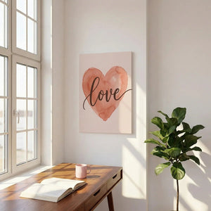 Romantic canvas wall art with a centered watercolor heart and cursive 'love' text on a muted warm-toned background.