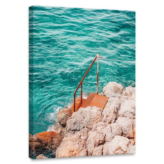 Turquoise coastal canvas wall art for bedroom featuring rocky shoreline and rust-colored ladder