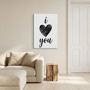 Minimalist canvas wall decor with bold black linework forming a heart and vertically stacked 'i' and 'you' text on white