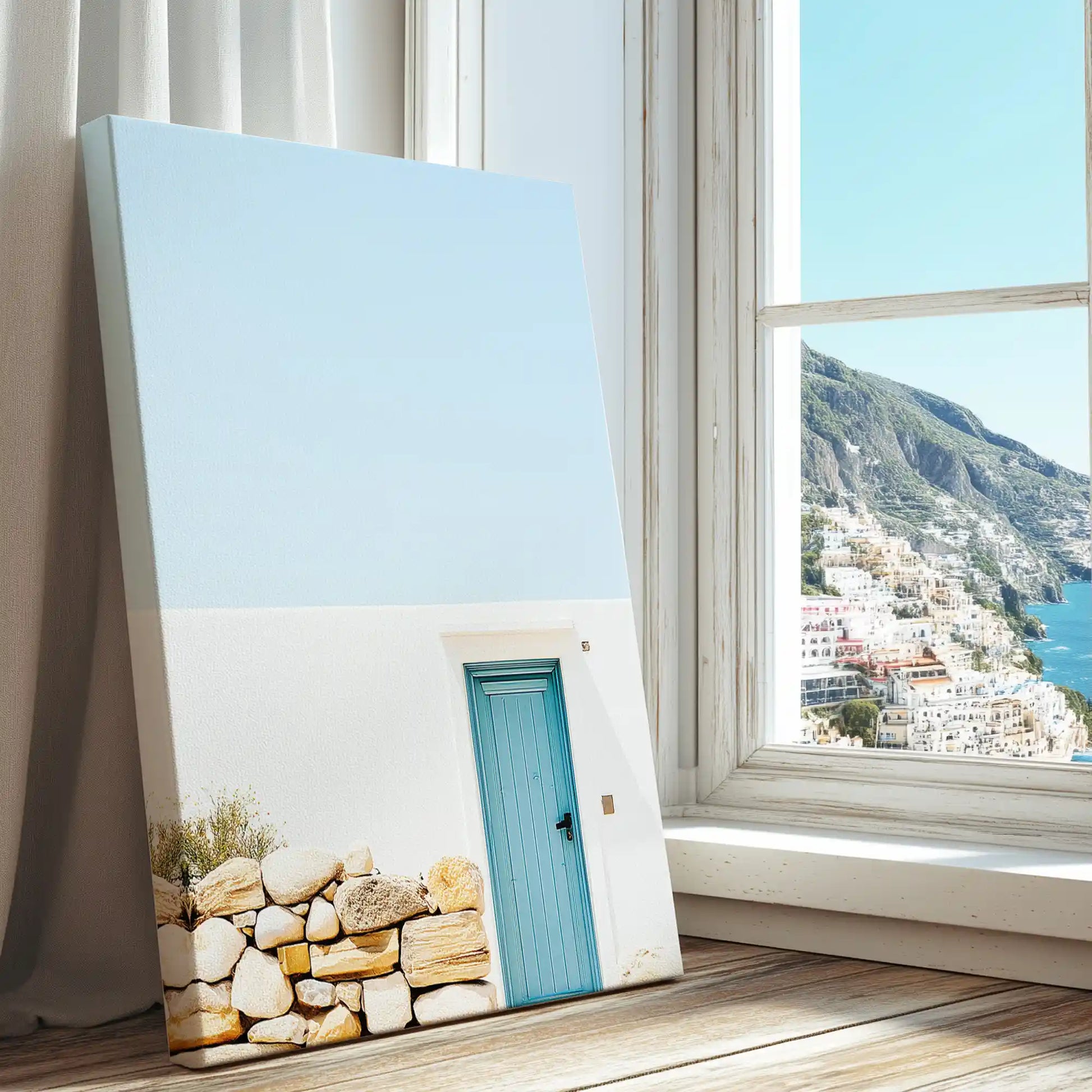 Whitewashed wall with turquoise door captured in a coastal canvas print with clean modern style