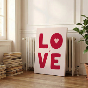 Pop art-inspired canvas artwork featuring high-contrast red and pink LOVE text with YOU vertically placed in the center