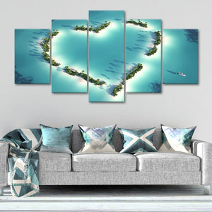 Ocean photography prints capturing a heart-shaped island oasis from above.