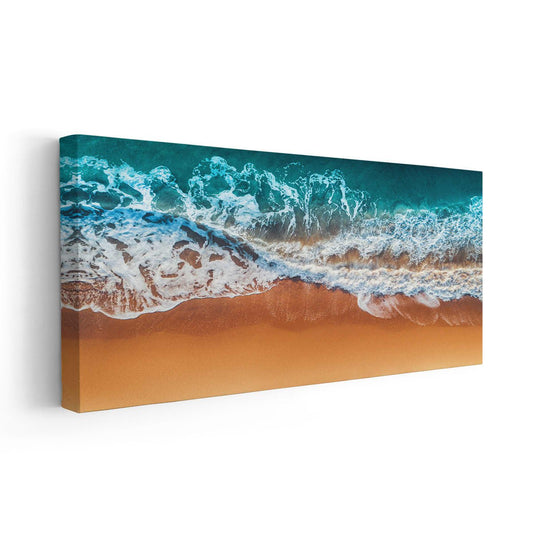 Aerial beach print capturing waves meeting the sandy shore.