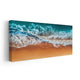Aerial beach print capturing waves meeting the sandy shore.