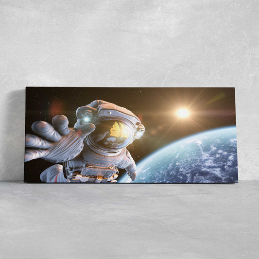 Astronaut floating above Earth canvas wall art for living room decor, glowing sunrise and deep blues create an inspiring space mood