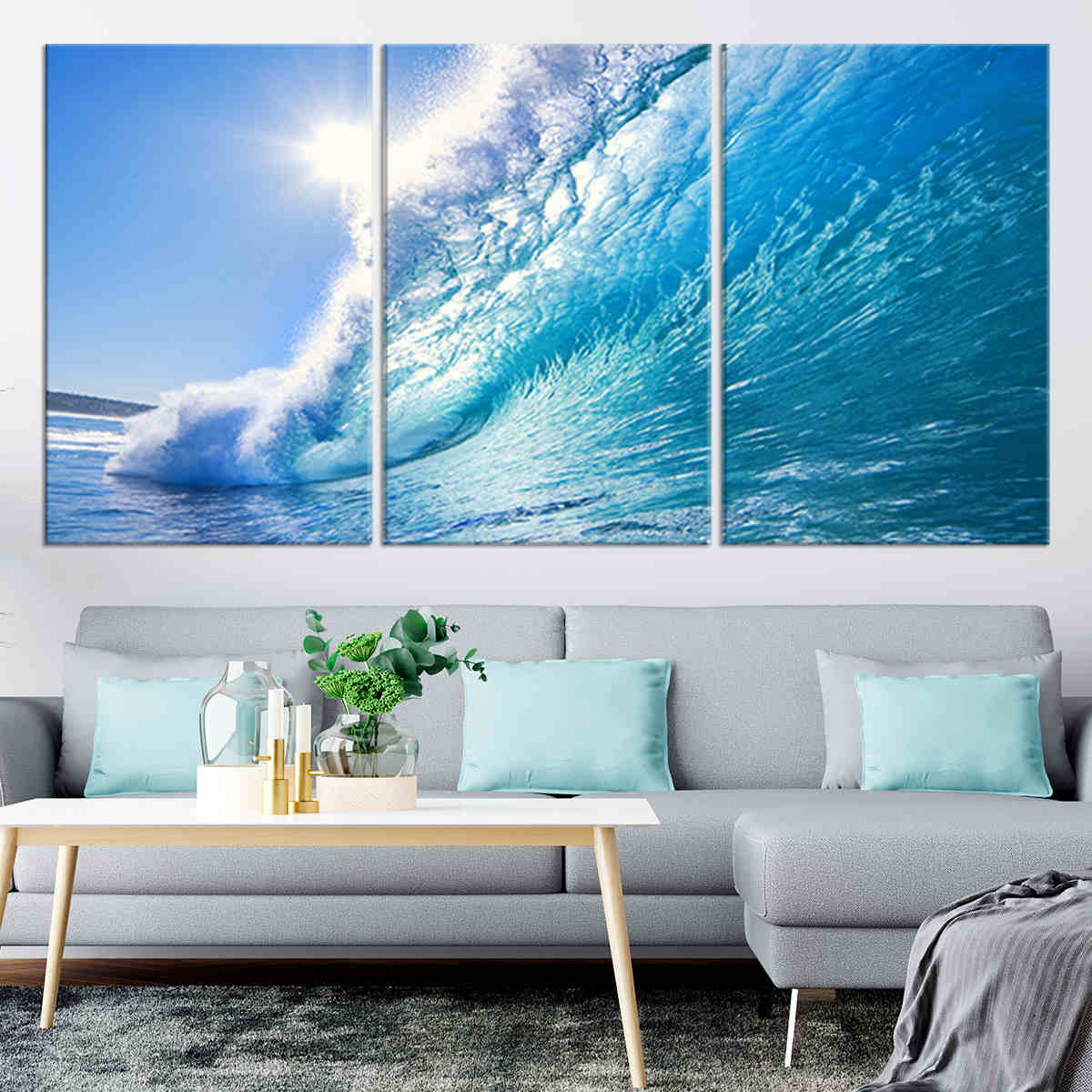 Ocean canvas print featuring a powerful curling wave under a bright blue sky.