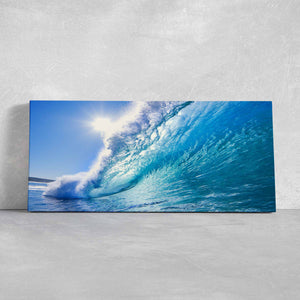 Stunning seaside wall decor capturing the beauty of a crashing wave in vibrant blue hues.