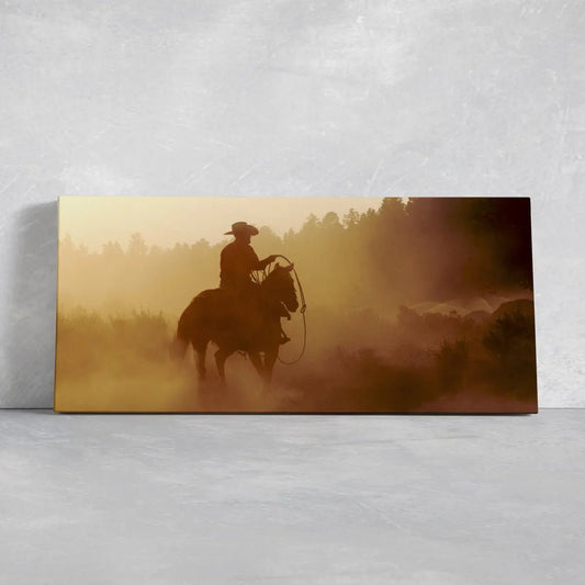 Lone cowboy riding through desert dust canvas wall art for living room, rustic western atmosphere with adventurous frontier energy