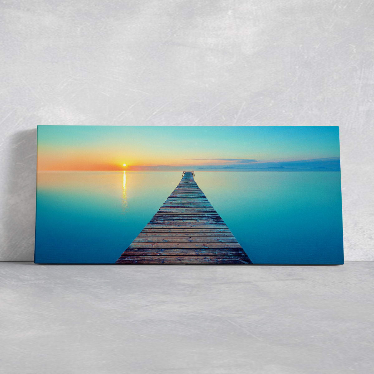Ocean canvas print with a wooden pier leading to a glowing sunset.