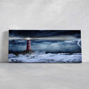 Stormy sea wall art with a lighthouse standing against crashing waves.
