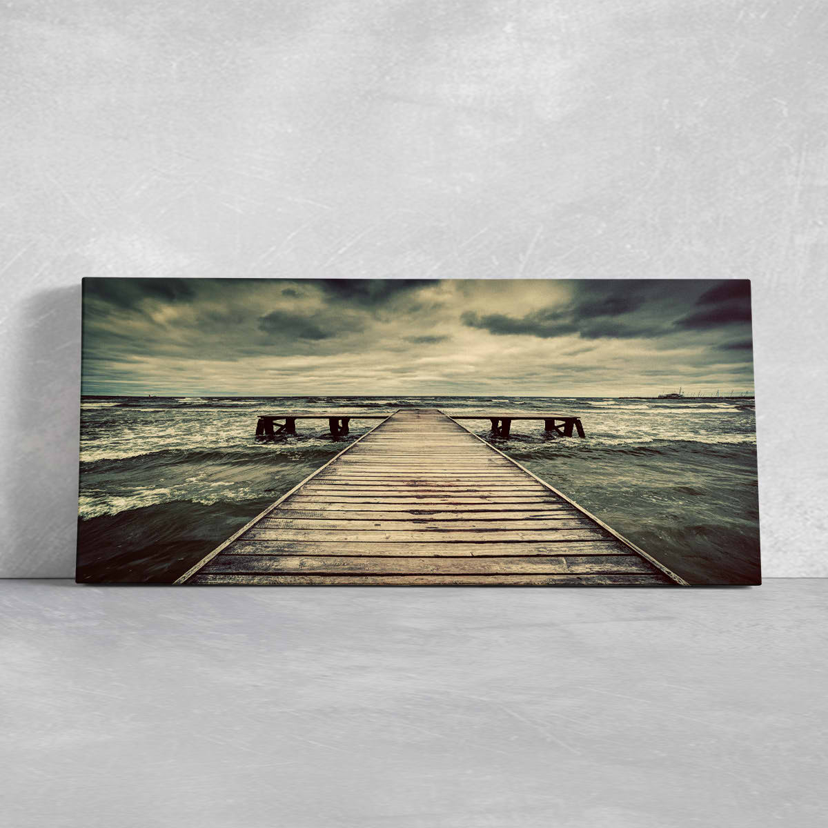 Framed beach prints with a rustic wooden dock leading into the open horizon.