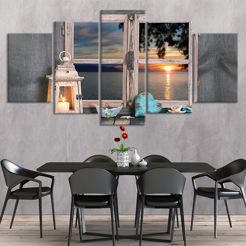 Coastal decor for home showcasing a lantern, seashells, and tranquil water views.