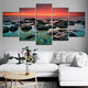 Peaceful ocean stones and glowing sunset in a framed artwork print.