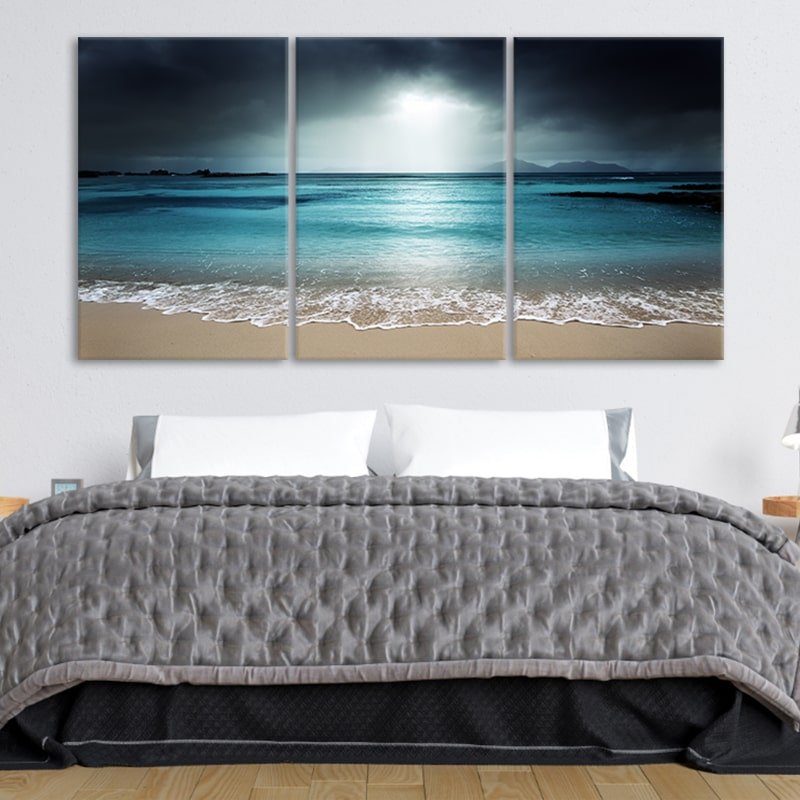 Coastal canvas prints capturing a serene beach scene with gentle waves.