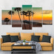 Nautical wall decor featuring a pier stretching into the sea under a tropical sunset.