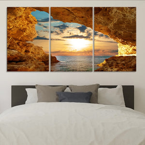 Large coastal canvas wall art featuring a golden sunset over the ocean.