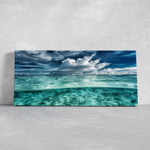 Ocean canvas prints showcasing transparent sea and a dramatic sky, ideal for modern coastal wall art.