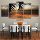 Abstract sunset wall art with palm trees and golden sky.