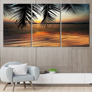Beach sunset wall art with warm hues and ocean waves.
